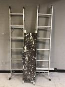 Two folding aluminium step ladders and a platform