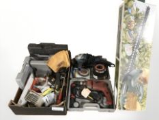 A group of tools including power drill, angle grinder, Black & Decker hedge trimmer,