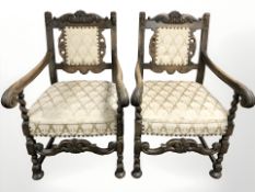 A pair of continental carved oak open armchairs,