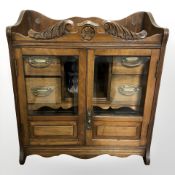 A late Victorian oak smoker's cabinet, width 41 cm.