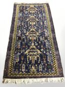 An Afghan/Caucasian rug,