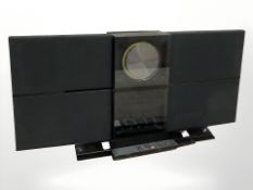 A Bang & Olufsen Beosound 2000 with remote