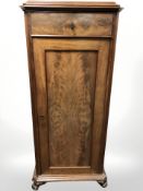 An early 20th century Danish walnut sentry door cabinet,