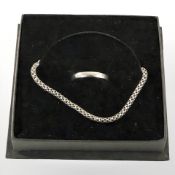 A silver box link bracelet and a silver band ring.