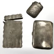 Two silver cigarette cases, one with damaged lid,