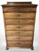 A late 19th century continental walnut seven drawer chest, 103 cm W x 51 cm D x 161 cm H.