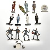 A group of hand painted lead The Beatles figurines.