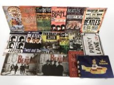 The Beatles - A quantity of reproduction enameled tin signs, width 30 cm.