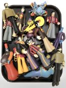 A group of The Beatles collector's figurines.