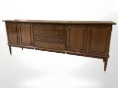 A late 20th century Danish teak sideboard, 220 cm L x 49 cm D x 85 cm H.