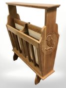 A carved magazine rack, signed A.B.