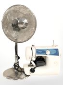 A Brother X-5 electric sewing machine and a fan