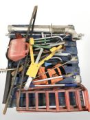 A pallet of hand tools, strimmer,