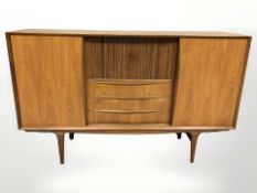 A 20th century Danish teak sliding door sideboard, 185 cm L x 46 cm D x 116 cm H.