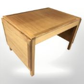 A 20th century Danish teak drop leaf coffee table, designed by Borge Mogensen,