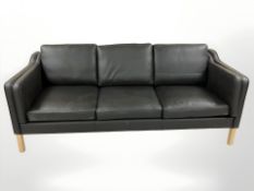 A late 20th century Danish wooden framed three seater settee, upholstered in black stitched leather,