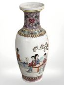 A 20th century Chinese porcelain baluster vase depicting ladies in traditional dress, height 31 cm.
