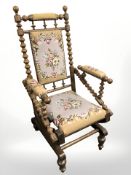 A continental oak bobbin turned rocking chair in tapestry fabric