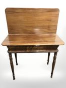 An early 20th century mahogany turnover top tea table,