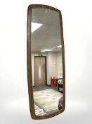 A 1970s teak mirror, 30 cm x 78 cm.