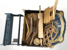 A quantity of teak coat hangers, gilt wood serving tray, carpet beaters and other wooden items.