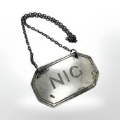 A scarce silver decanter label 'Nig' (pseudonym for gin), Nayler Brothers,