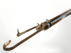 Two bundles of walking and shooting sticks.