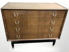 A 20th century G Plan teak and ebonised four drawer chest designed by E.