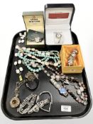 A group of costume jewellery, beaded necklaces, pendant on chain, Swiss military style wristwatch,
