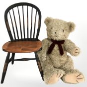 A Teddy bear and a miniature spindle back chair