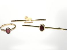 A 9ct yellow gold bar brooch, set with a garnet, an antique yellow gold ring set with a ruby,