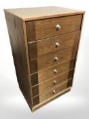 An oak veneered MDF six drawer chest, 50 cm x 42 cm x 89 cm.
