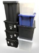 Seven plastic storage boxes with lids,