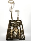 A group of brass lamp bases and wall sconces.
