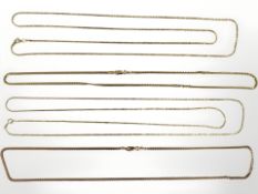 Four Sterling silver gilt necklaces,