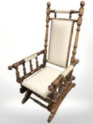 An early 20th century oak rocking chair