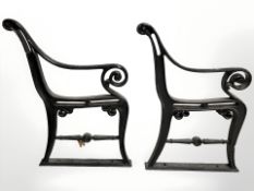 A pair of painted cast iron bench ends.
