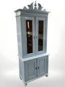 An early 20th century painted pine double door bookcase,