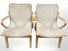 A pair of Scandinavian bentwood armchairs with canvas lattice seats, width 62 cm.