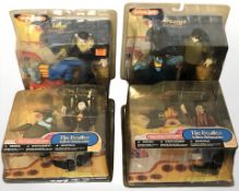 Four McFarlane Toys The Beatles Yellow Submarine figurines, in original packaging.