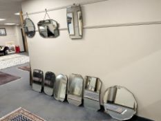 Nine early 20th century frameless mirrors.