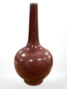 A Chinese sang de boeuf porcelain vase, blue six character mark to base, height 26.5 cm.