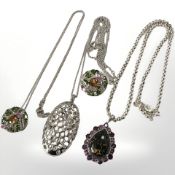 Three Sterling silver pendants on chains, one with matching dress ring.