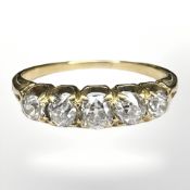 An 18ct gold five stone old-cut diamond ring, the total diamond weight estimated at 0.