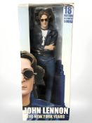 A Neca John Lennon The New York Years figurine, in original box, height 48 cm.