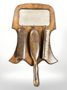 An oak wall mirror and brush set, mirror 39 cm high.