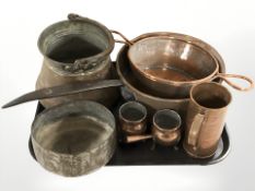 A group of copper kitchenalia including steel handled cooking pan, sieve, measures, etc.