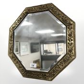 A 1930s octagonal bevelled mirror, width 44 cm.