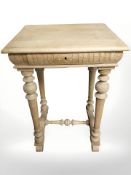 A Danish blond oak side table, fitted a drawer,