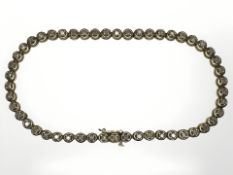 A 9ct yellow gold diamond line bracelet, set with fifty diamonds approximately 1ct, length 20 cm.